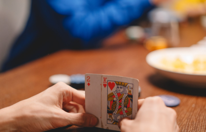 holding poker cards